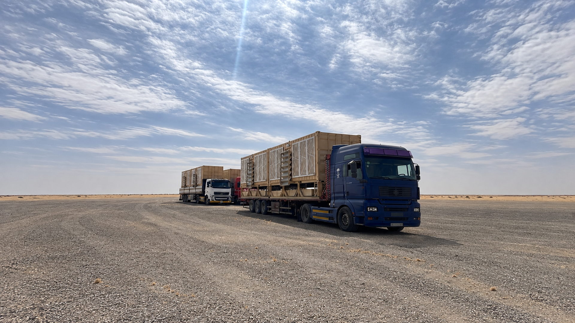 Crane lowering a portable restroom unit with laser-cut screen facade at a project site in Saudi Arabia — Advance Cabin